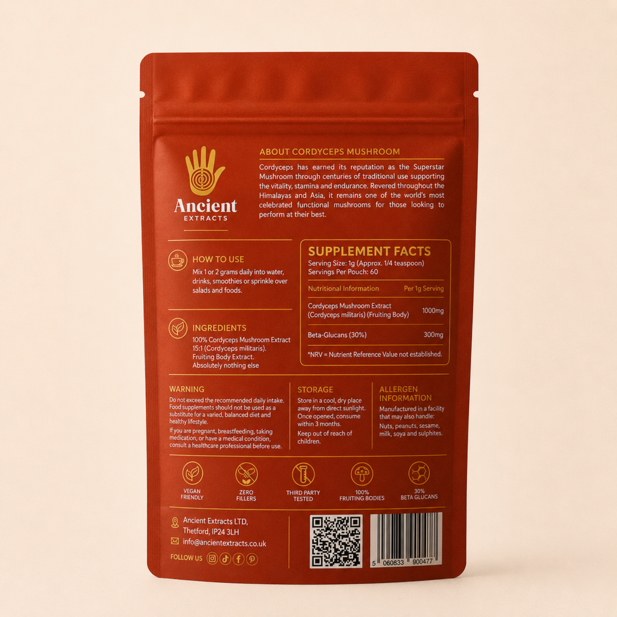 The back of an orange Ancient Extracts Cordyceps Mushroom Supplement pouch, showing product details, usage instructions, ingredients, storage, and a barcode on a light beige background.